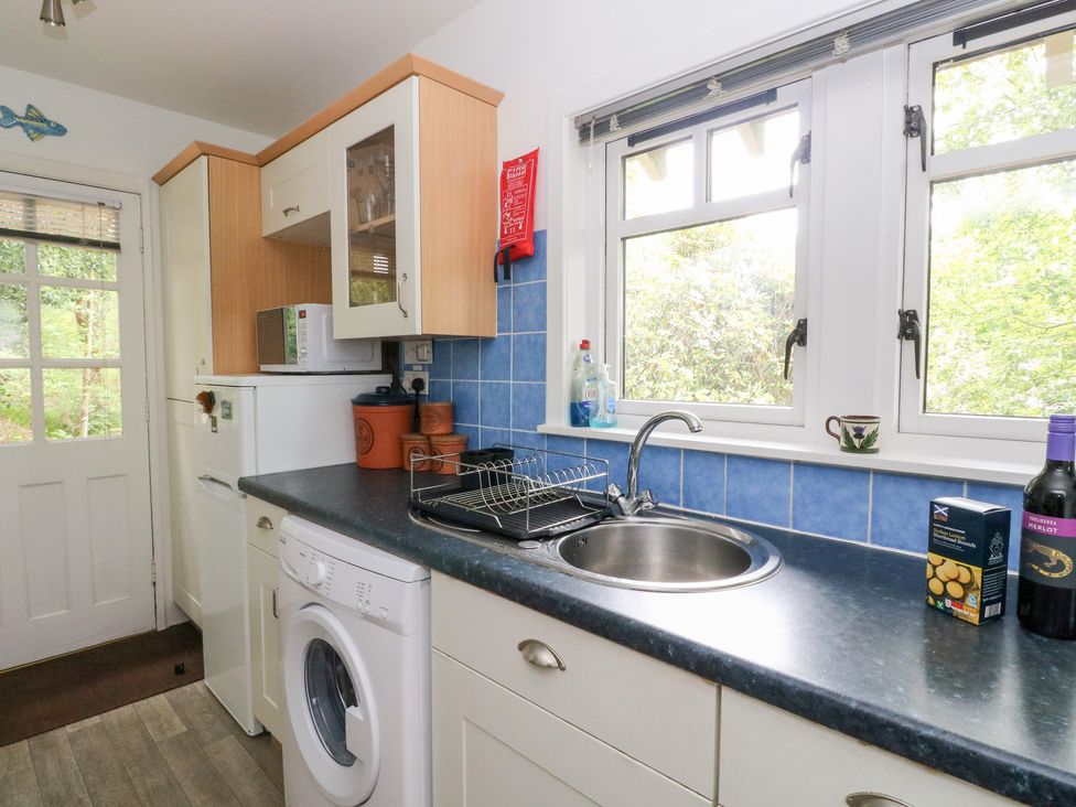 A kitchen with appliances and sink at Tower Lodge, Lochawe