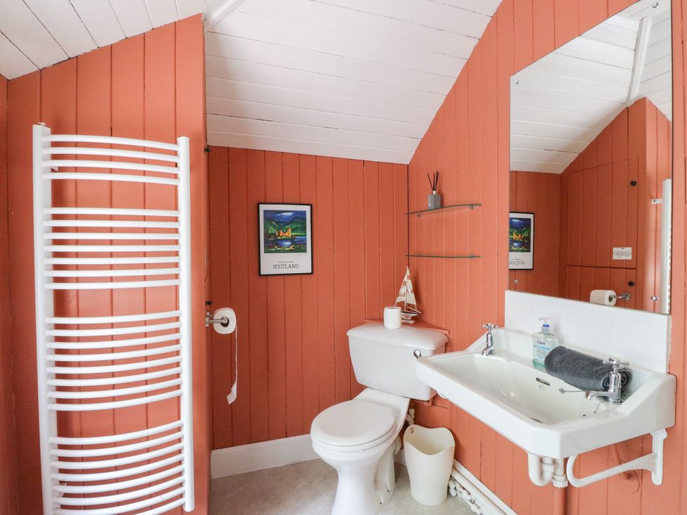 A bathroom with a sink and toilet at Tower Lodge in Lochawe