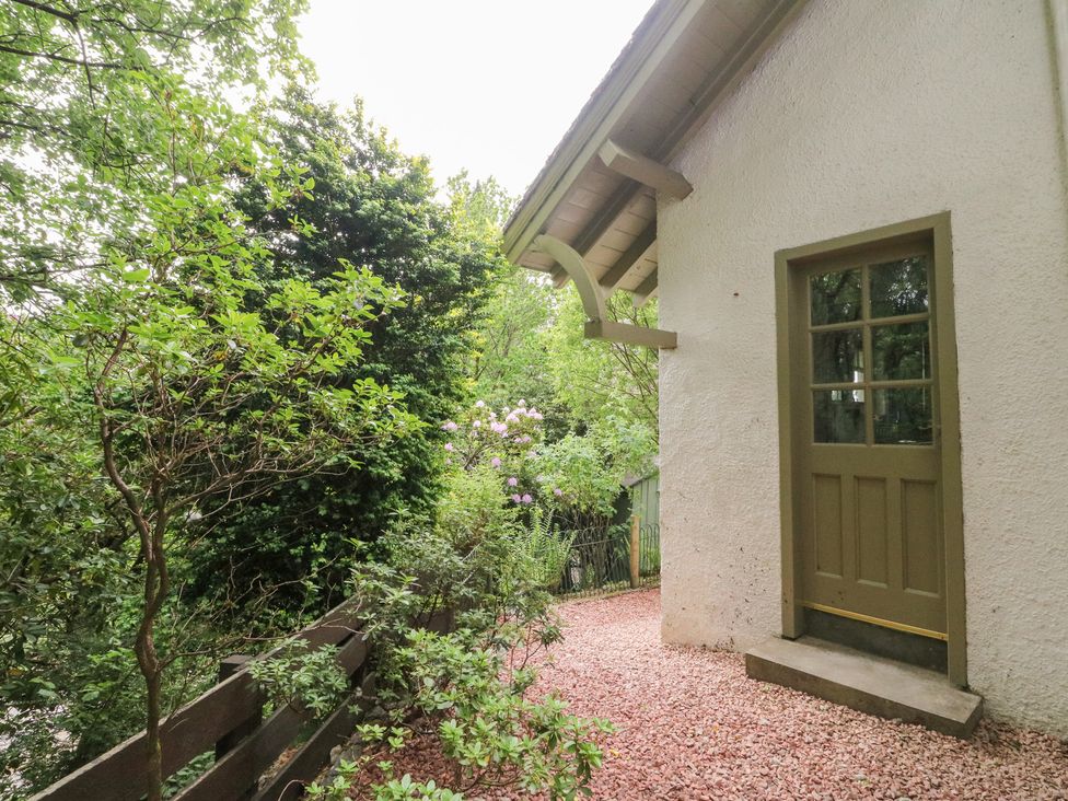 An outdoor area with a door and plants at Tower Lodge Lochawe