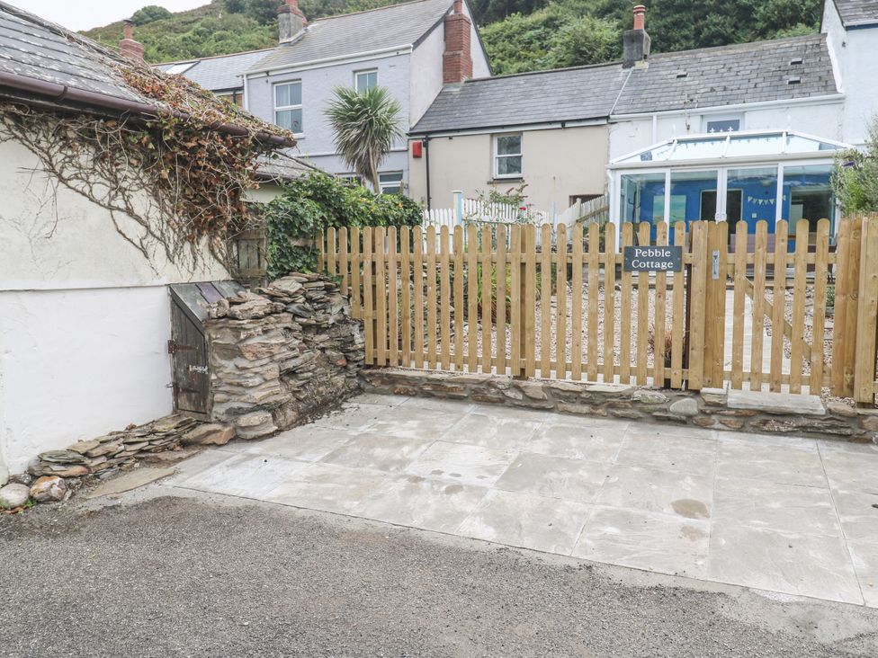 An outdoor area with a sign for Pebble Cottage in Portreath