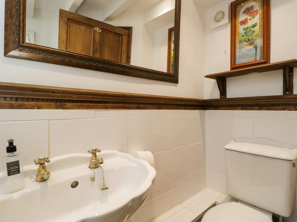 A bathroom with a sink and toilet at Ivy Cottage in Woolverton near Beckington