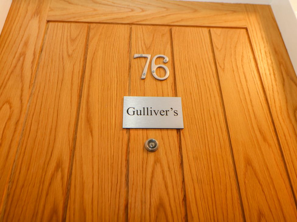 A door with number 76 and a plaque that reads Gulliver's at Gulliver's (76) Matlock