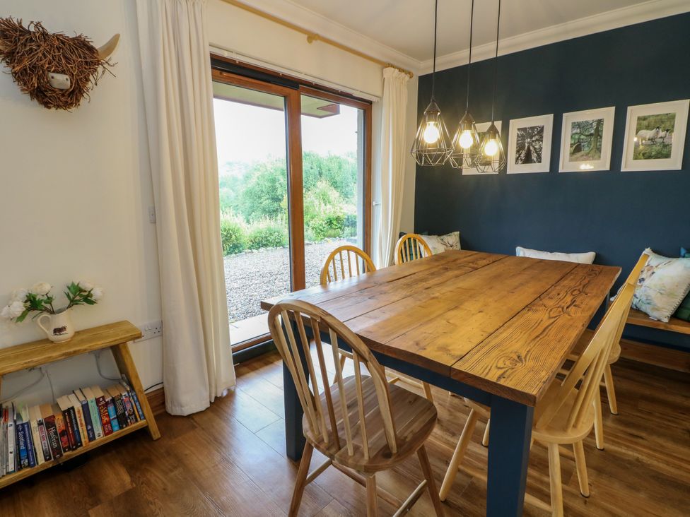 A dining room with a table and chairs at Thistle Do in Lochailort