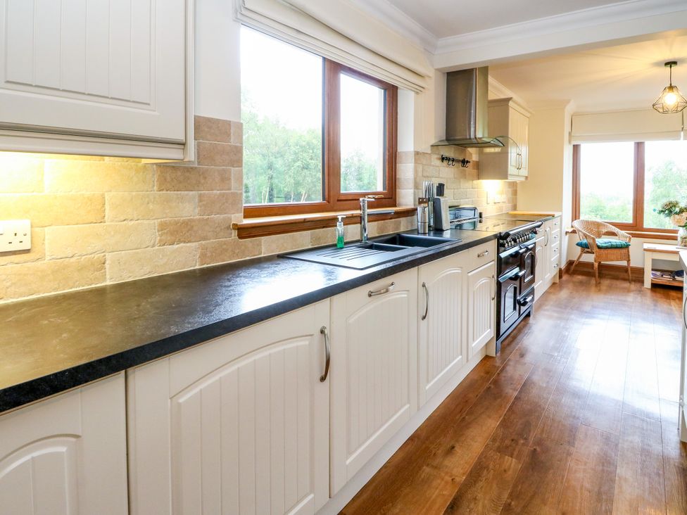 A kitchen with a sink and countertop at Thistle Do in Lochailort