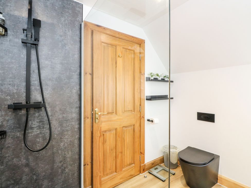 A bathroom with a shower and toilet at Thistle Do Lochailort