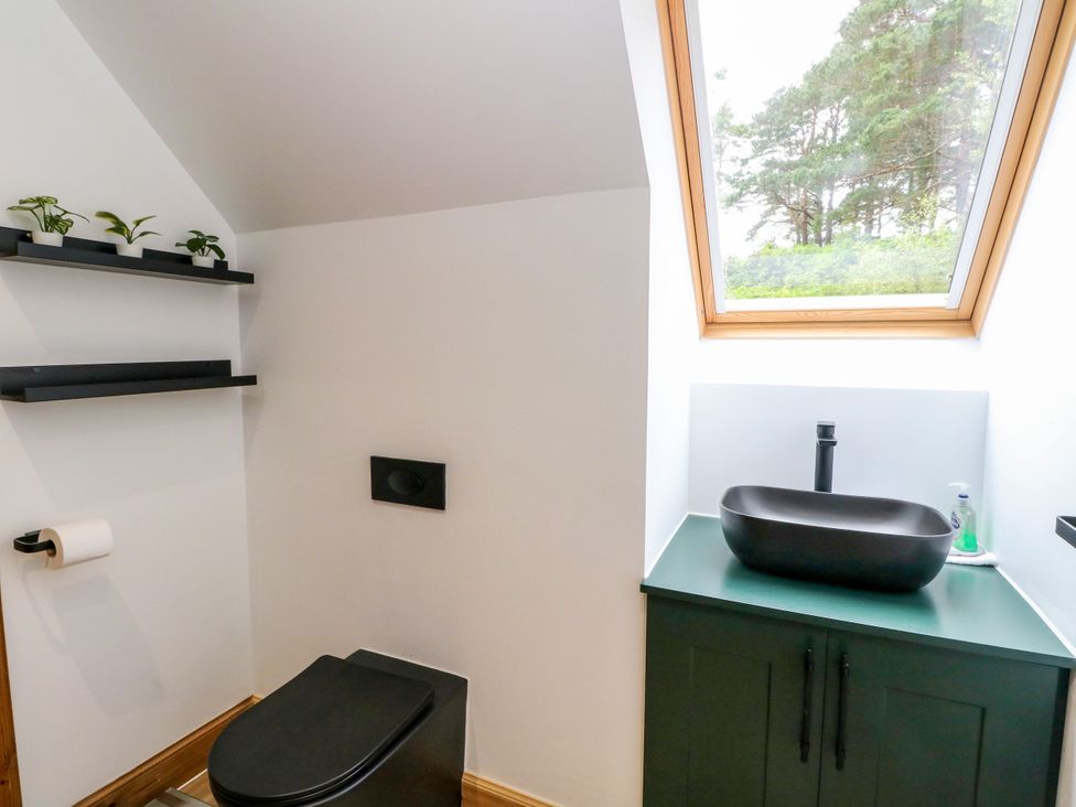 A bathroom with a sink and toilet at Thistle Do in Lochailort