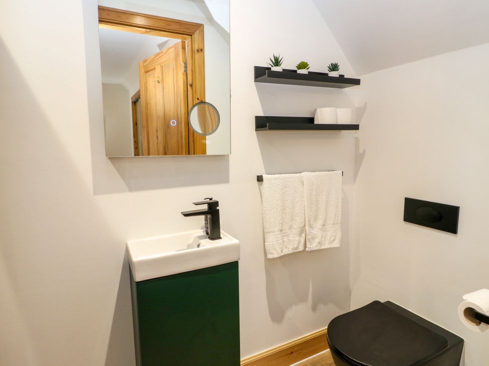 A bathroom with a sink and toilet at Thistle Do in Lochailort