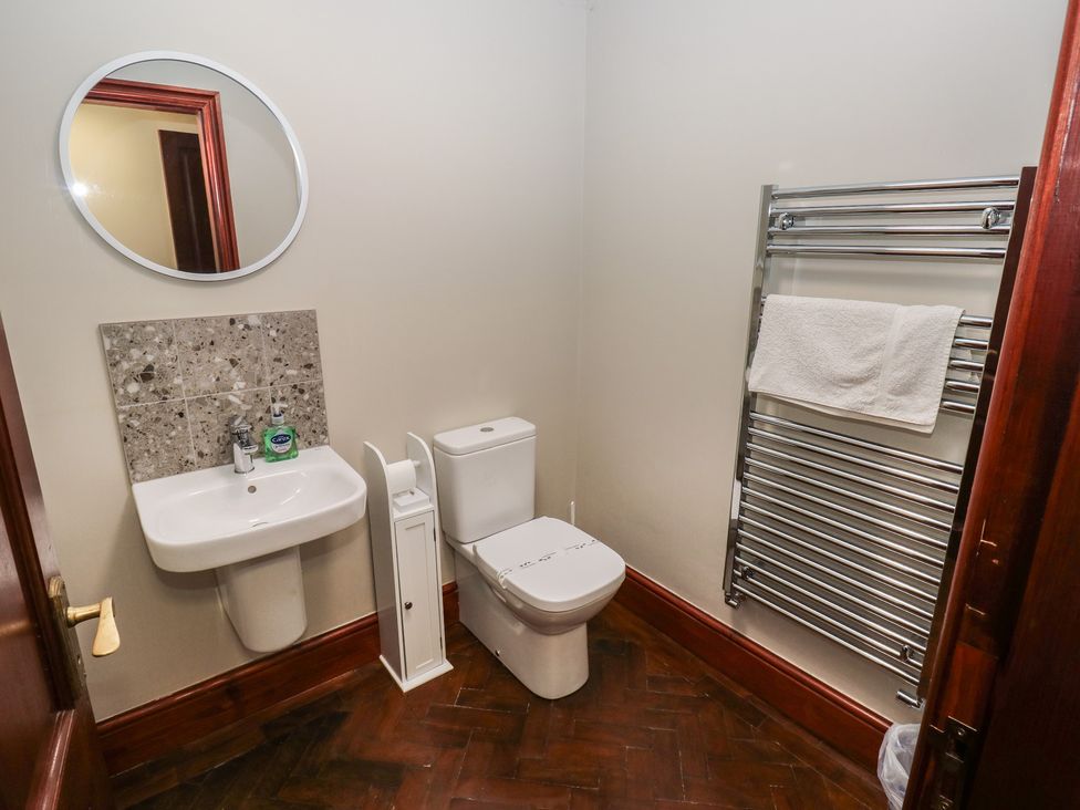 A bathroom with a sink and toilet at Shoebroad Barn in Todmorden