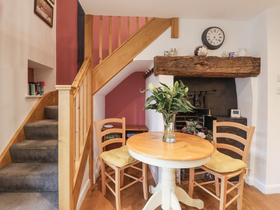 A dining room with a table and chairs at The Farmhouse Kitchen in Ripon