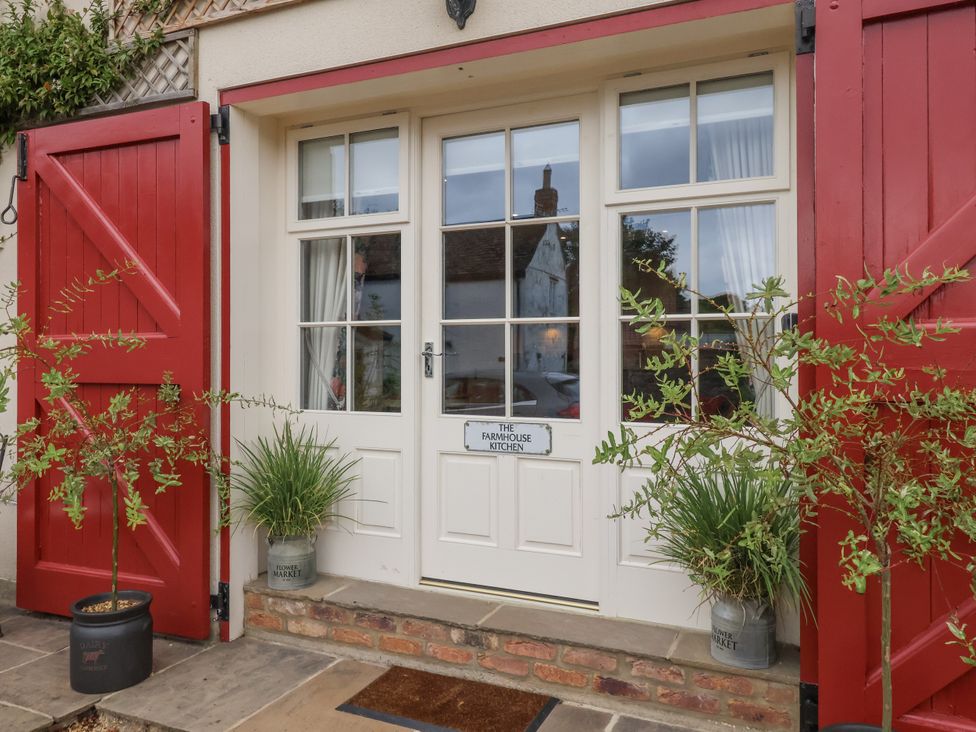 An entryway with double doors and plants at The Farmhouse Kitchen in Ripon