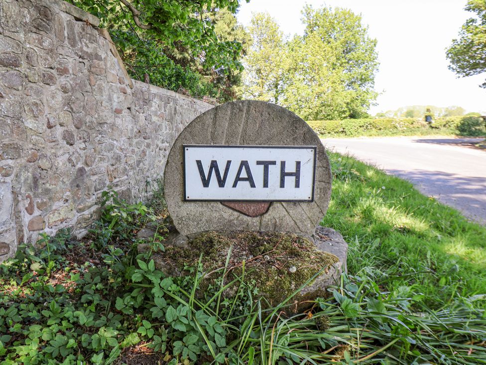 A sign reading 'WATH' by a road in Ripon