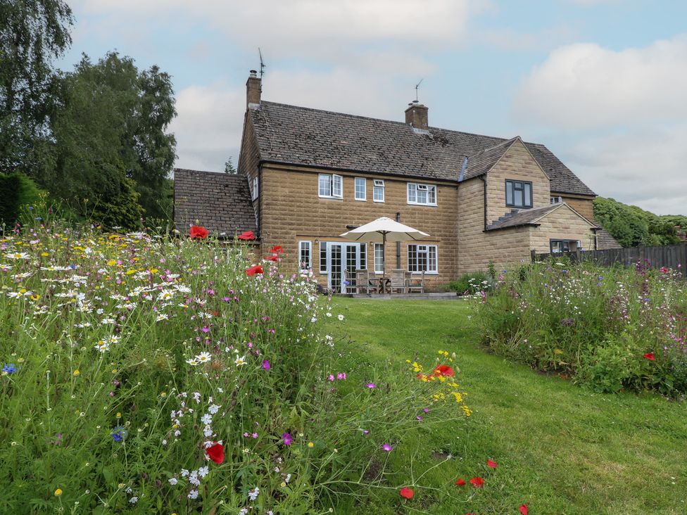 A house with flowers in the garden at Ivet Lowe Hopton near Wirksworth