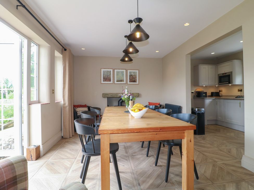 A dining room with a table and chairs at Ivet Lowe in Hopton near Wirksworth