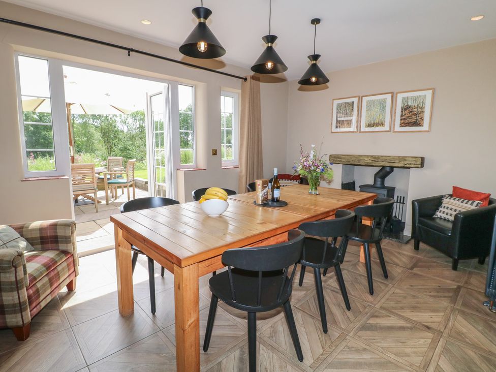 A dining room with a table and chairs at Ivet Lowe in Hopton near Wirksworth