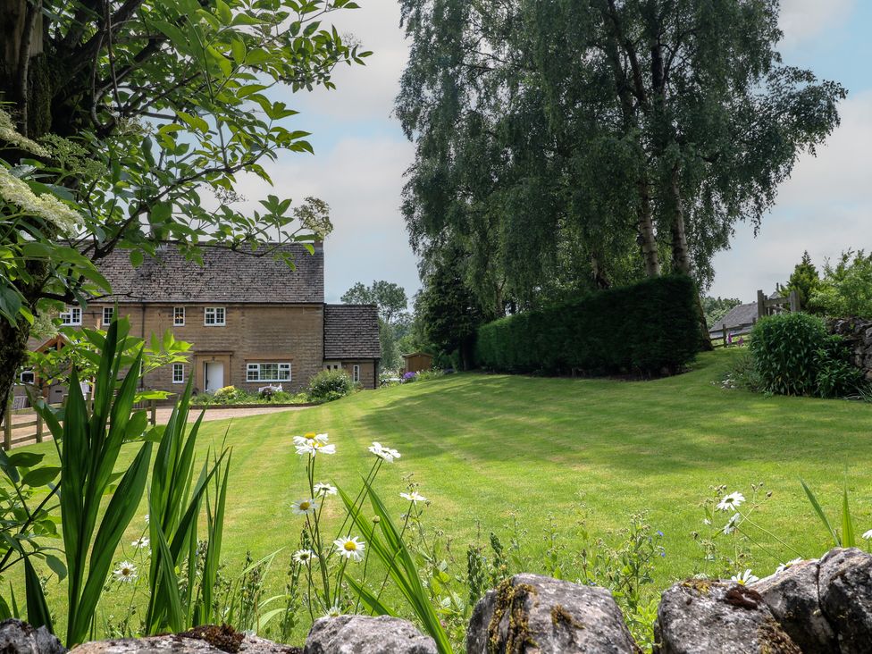 A house with a garden and trees at Ivet Lowe in Hopton near Wirksworth