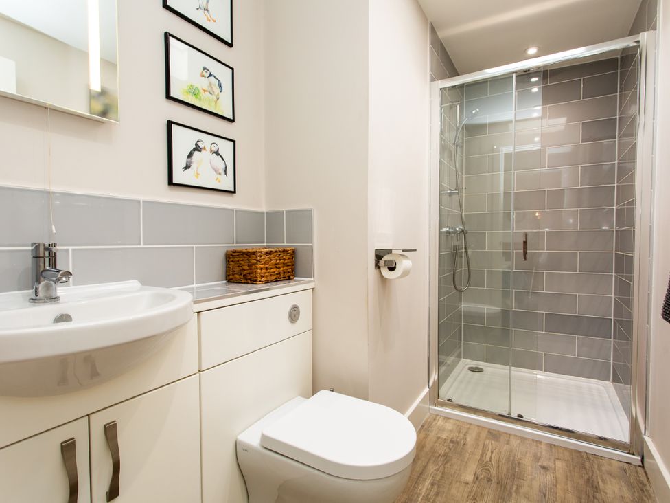 A bathroom with a shower and sink at Betony in Bamburgh