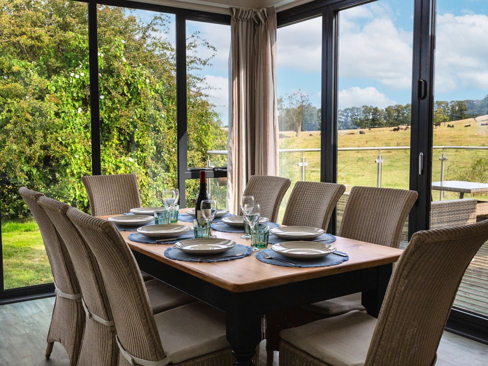A dining room with a table set for meals at Betony in Bamburgh