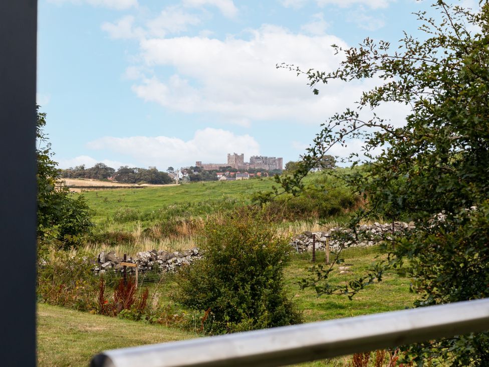 A view of a castle from a field at Betony in Bamburgh