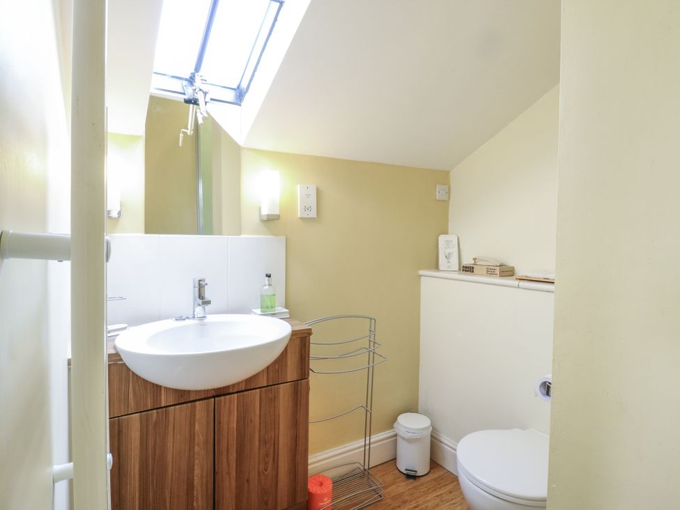 A bathroom with a sink and toilet at Over Village Studio in Over