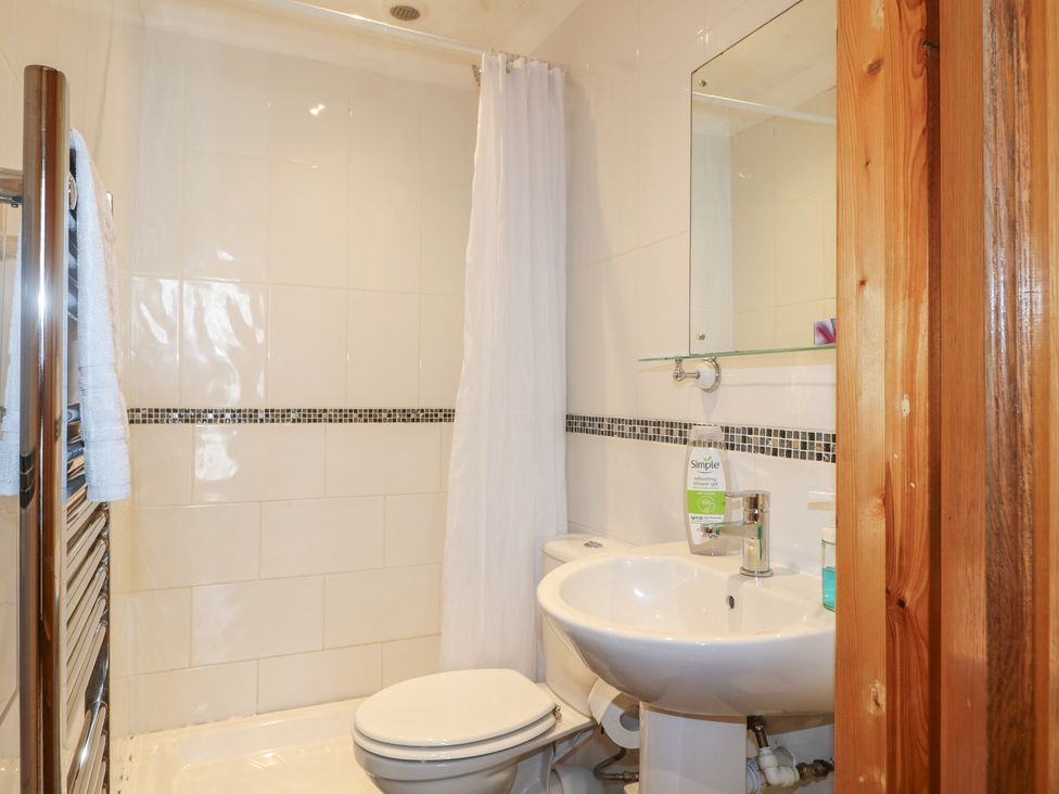A bathroom with a toilet and sink at Hambleton House in Castle Donington