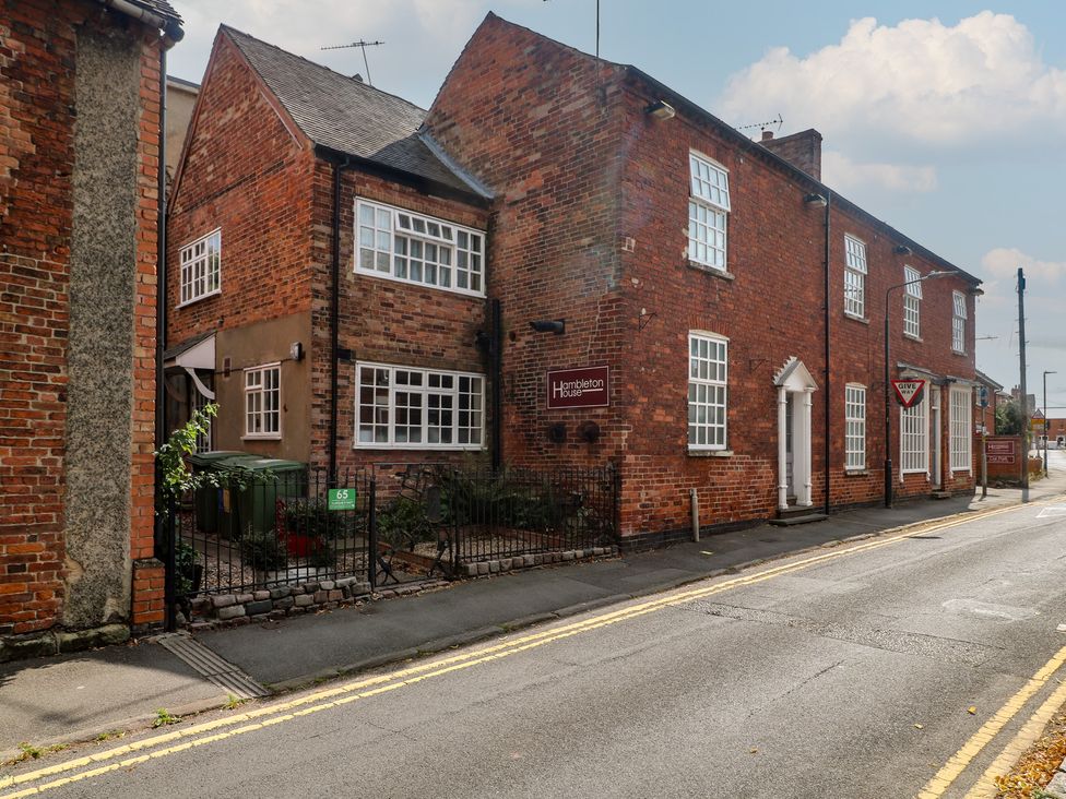A brick building with a sign at Hambleton House in Castle Donington