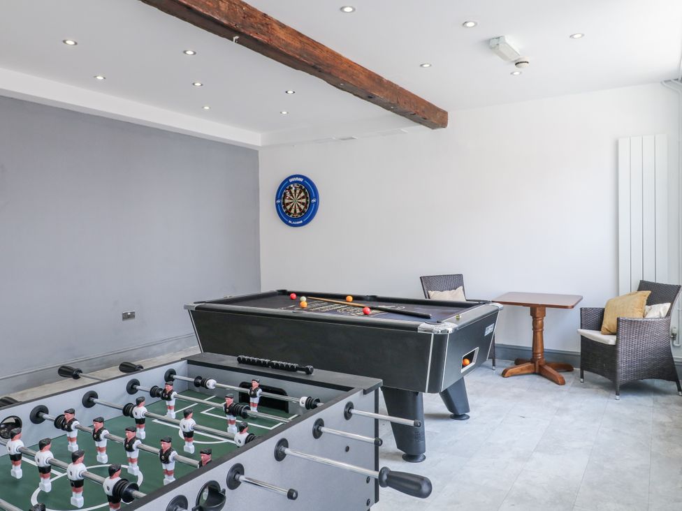 A recreation room with a foosball table and a pool table at Hambleton House in Castle Donington
