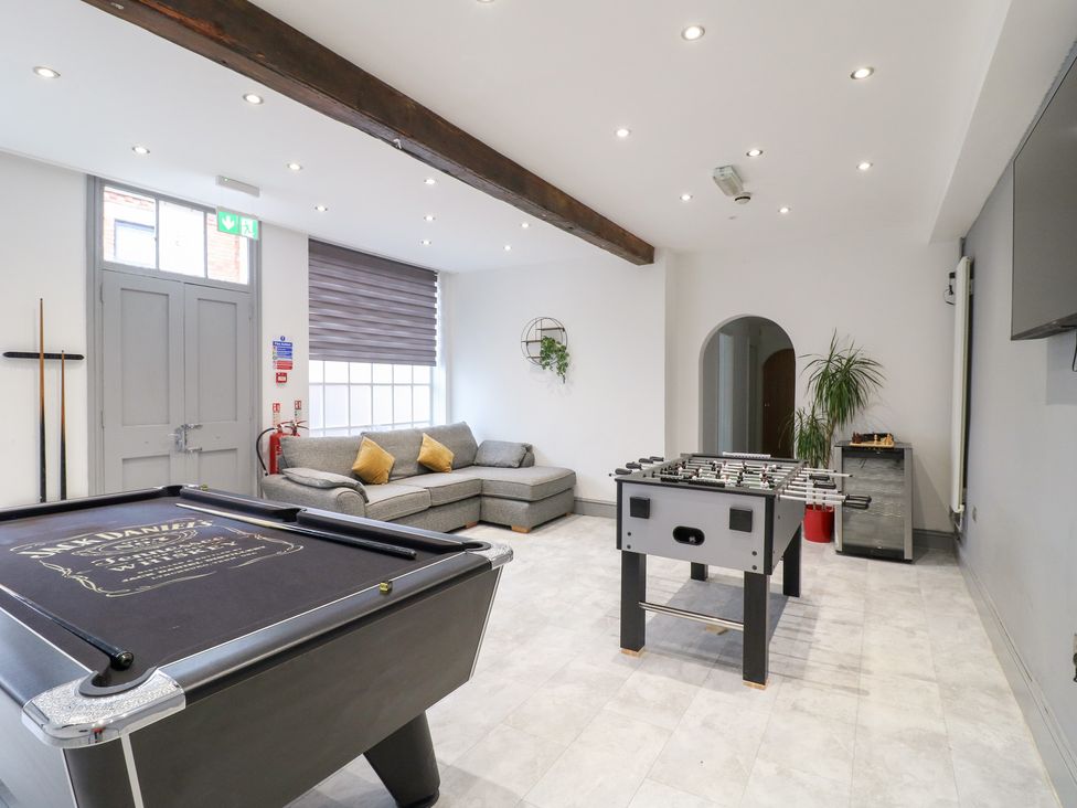 A recreation room with a pool table and a foosball table at Hambleton House Castle Donington