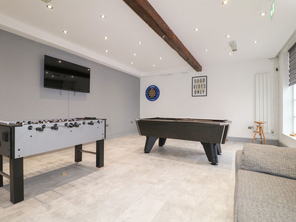 A game room with a pool table and table football at Hambleton House in Castle Donington