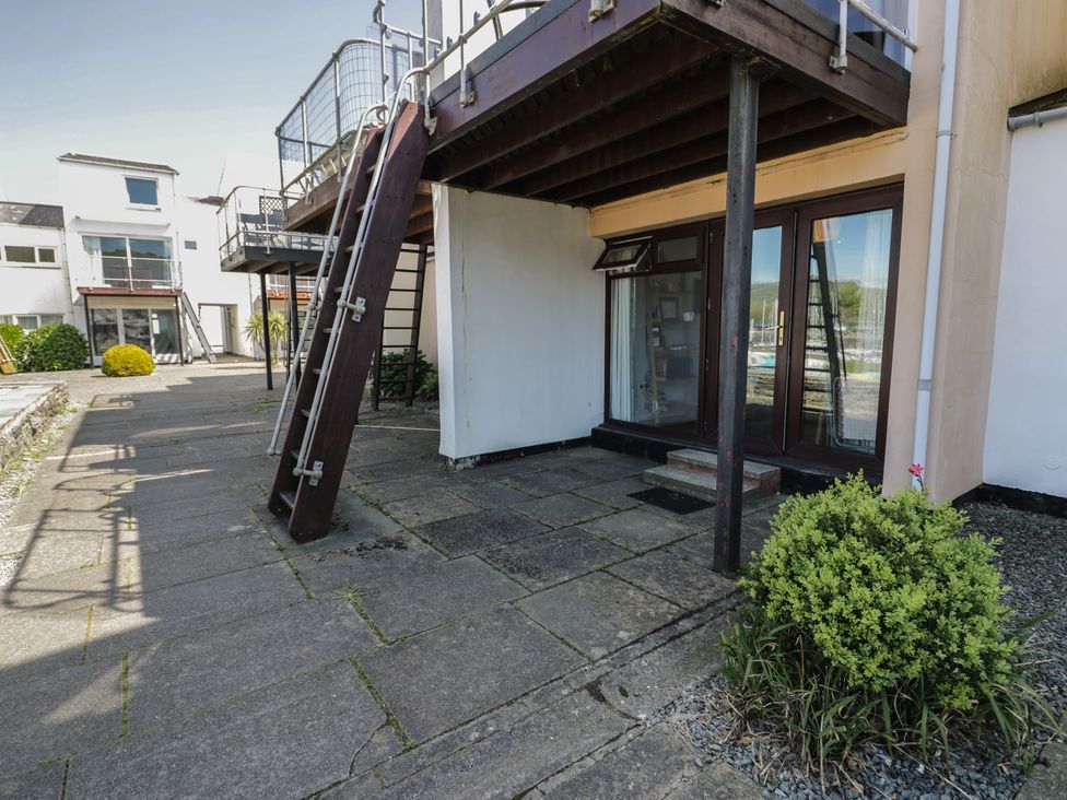 An outdoor area with stairs leading to a balcony at 56C South Snowdon Wharf Porthmadog