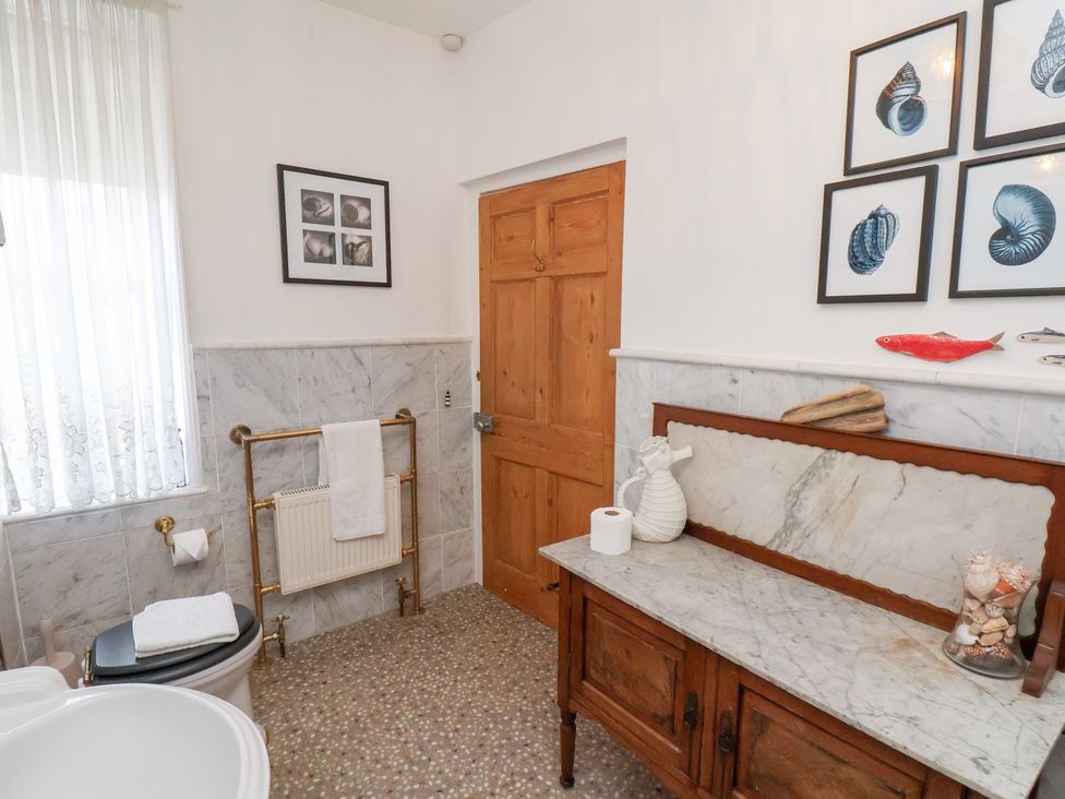 A bathroom with a toilet and sink at 20A St Hilda's in Whitby
