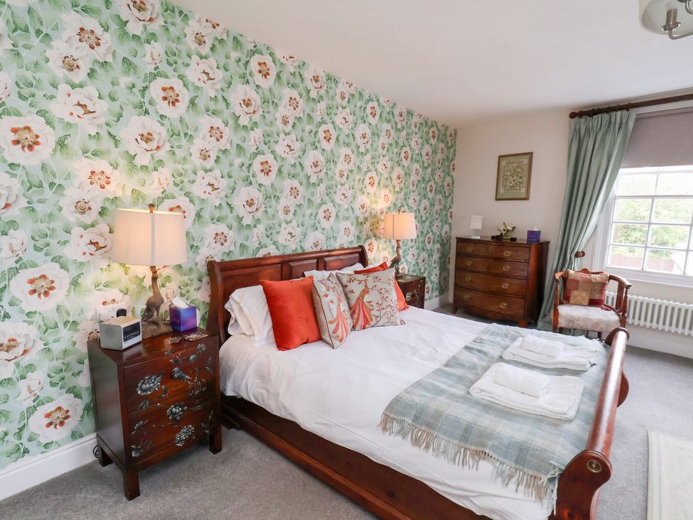 A bedroom with a bed and bedside table at 20A St Hilda's in Whitby