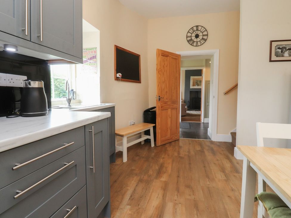 A kitchen with a kettle and sink at Glebe Cottage Broughton near Skipton