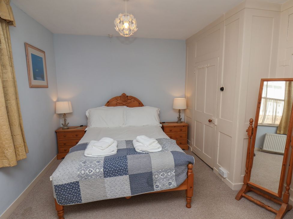 A bedroom with a bed and chest of drawers at Cobbles House, Whitby