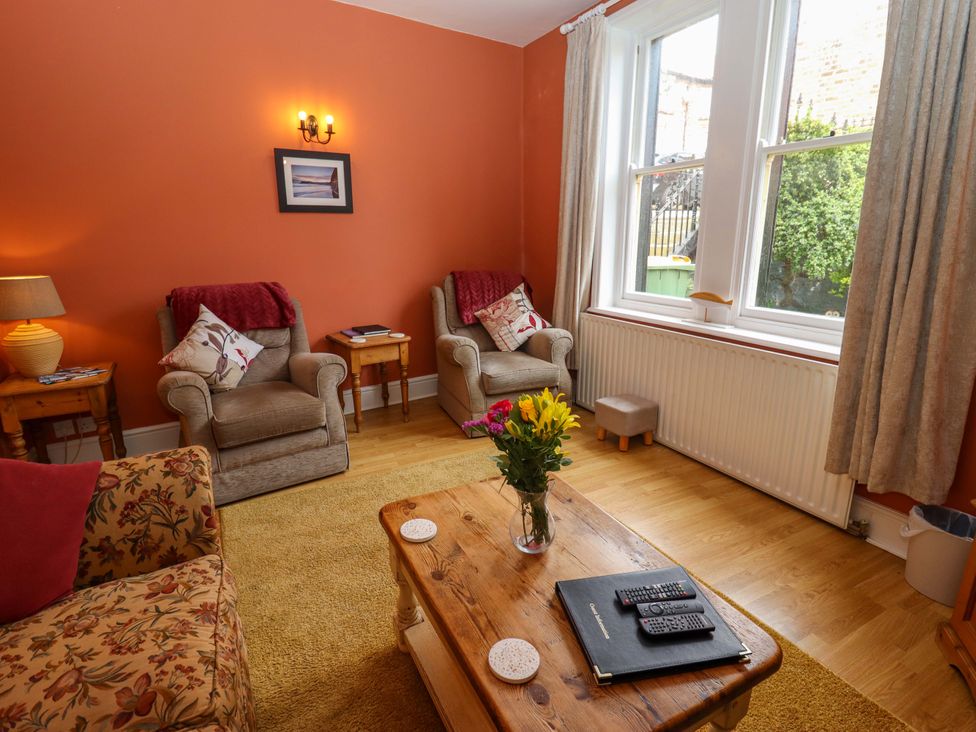 A living room with a sofa and armchairs at West End House in Whitby