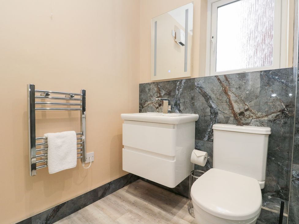 A bathroom with a sink and toilet at Quayside Haven in Whitby