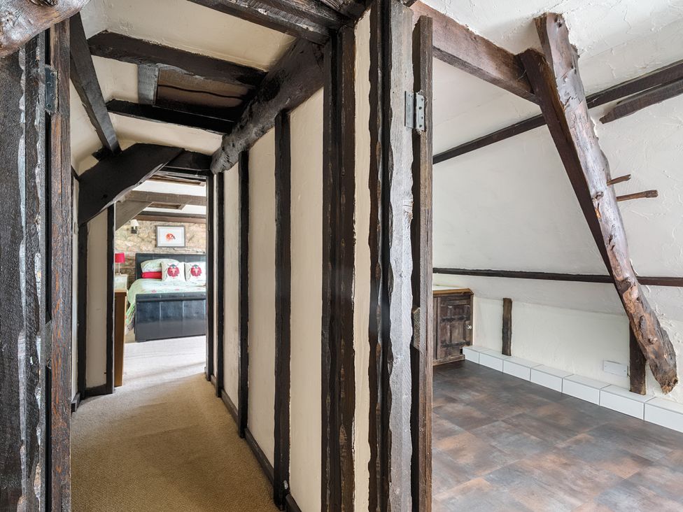 A hallway leading to a bedroom at The Old Church House in Torbryan