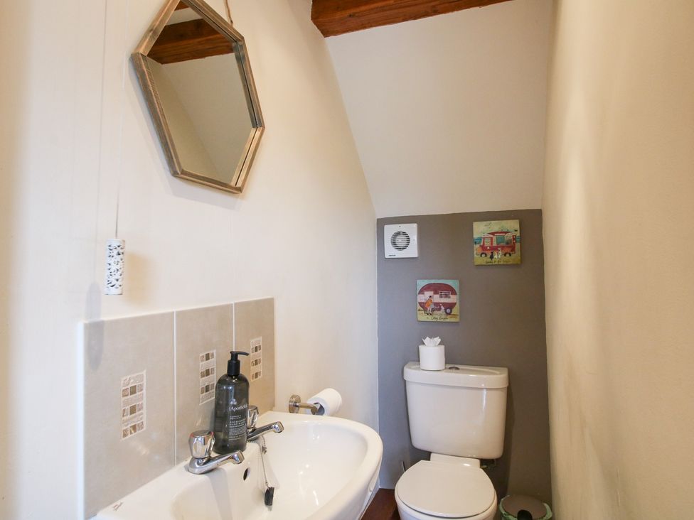 A bathroom with a sink and toilet at Old Hall Barn 3 Church Stretton
