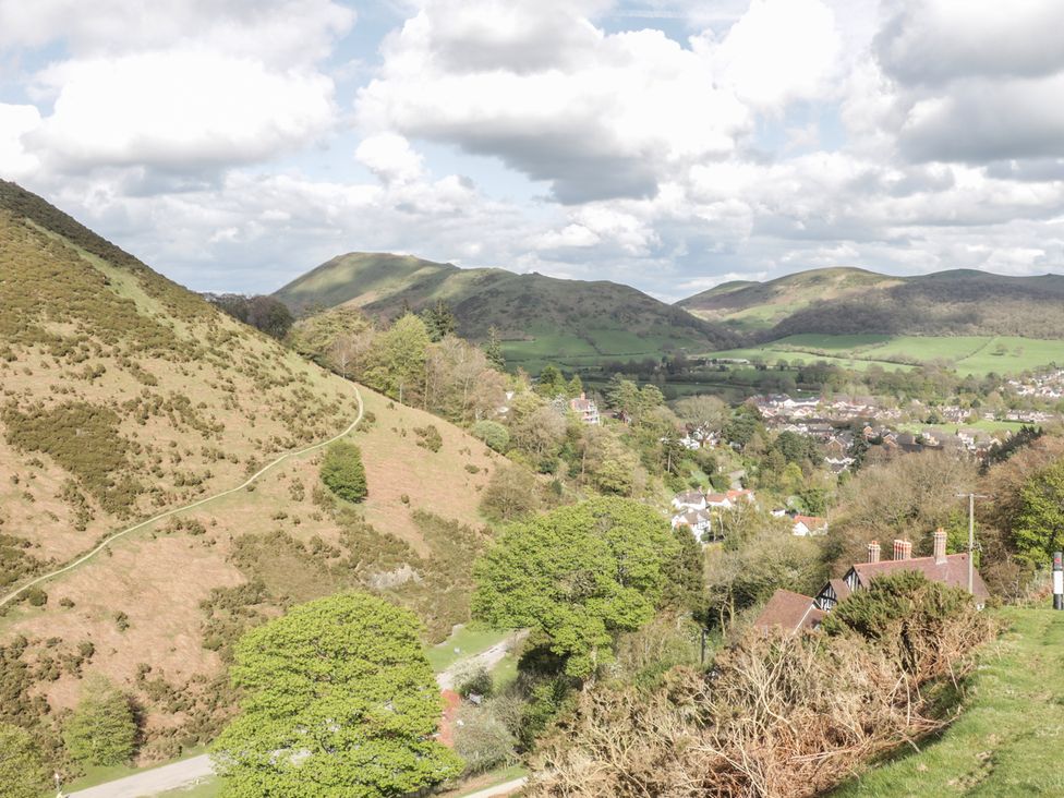 A landscape view of hills and houses at Old Hall Barn 3 Church Stretton