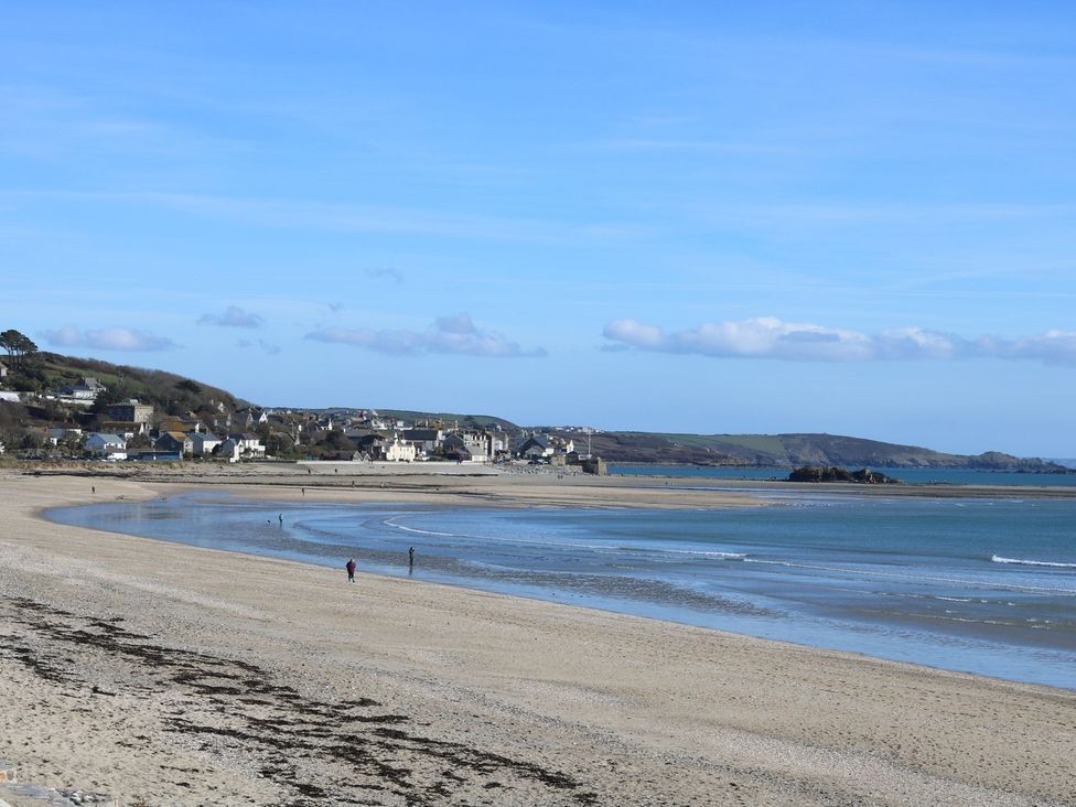 A beach with water and people at Kernyk near Rinsey near Porthleven