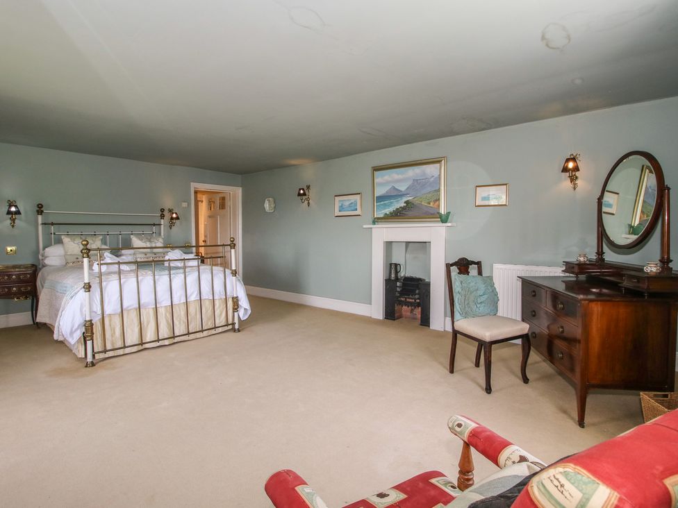 A bedroom with a bed and furniture at Hilltop House in Tenbury Wells