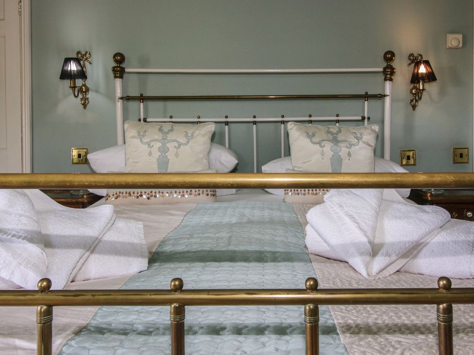 A bedroom with a bed and pillows at Hilltop House in Tenbury Wells