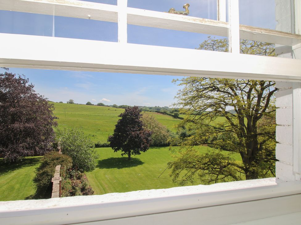A view of green fields and trees from a window at Hilltop House in Tenbury Wells