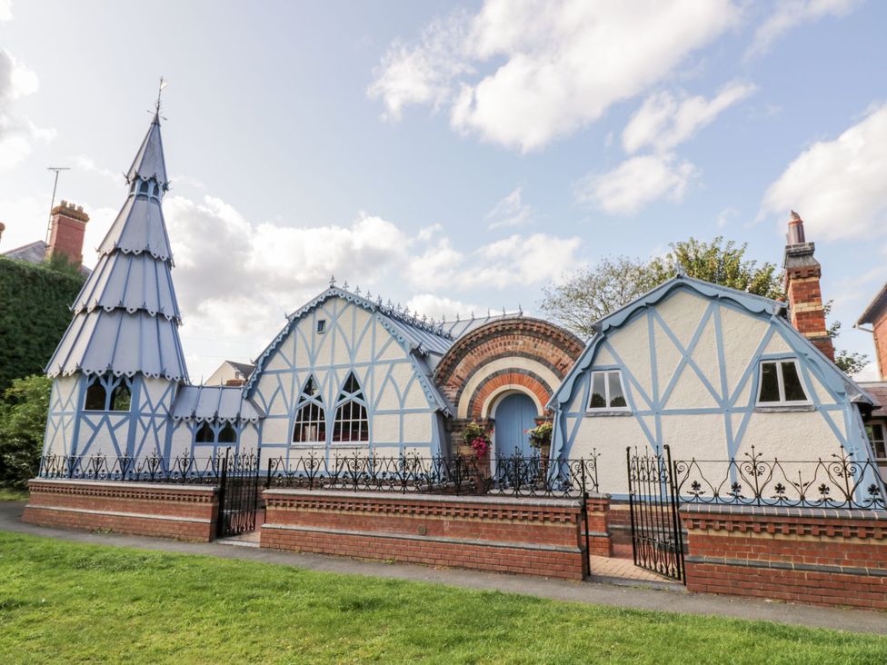 A house with a tower and multiple windows at The Chestnuts in Tenbury Wells