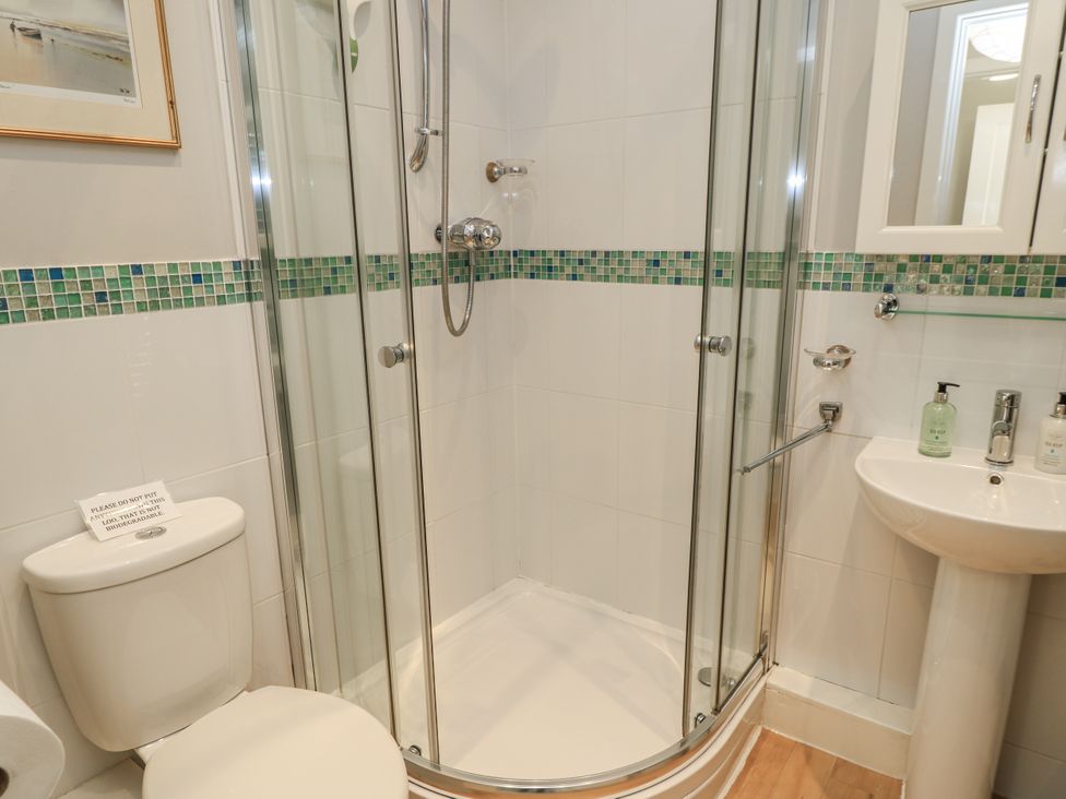 A bathroom with a shower and sink at Keepers Cottage in West Knoyle