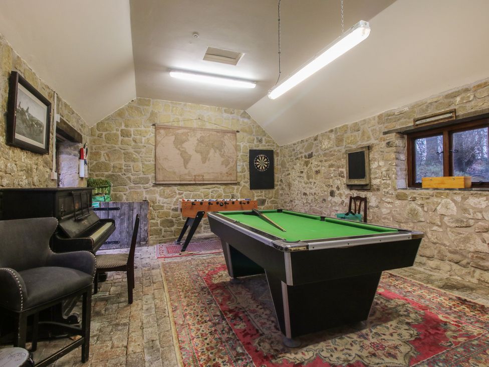 A games room with a pool table and foosball table at Turnip House Cardington