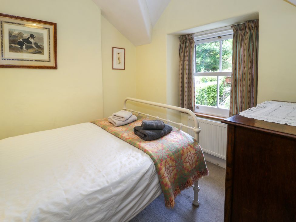 A bedroom with bed and window at Sygun View in Beddgelert