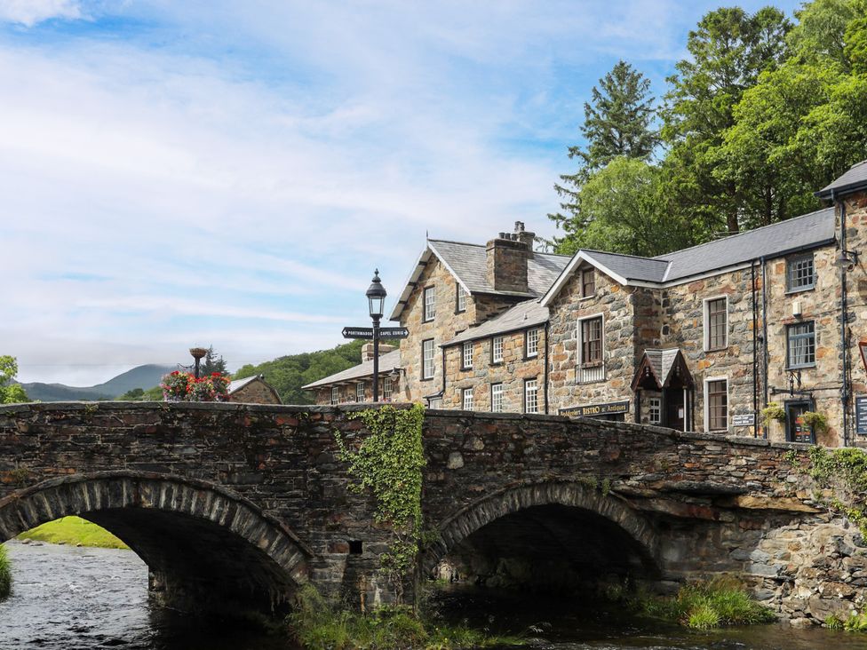 A bridge and building near a river at Sygun View in Beddgelert