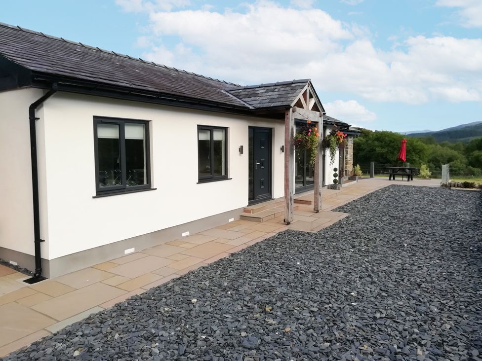 An outdoor view of a house with a pathway at Cartref in Trawsfynydd