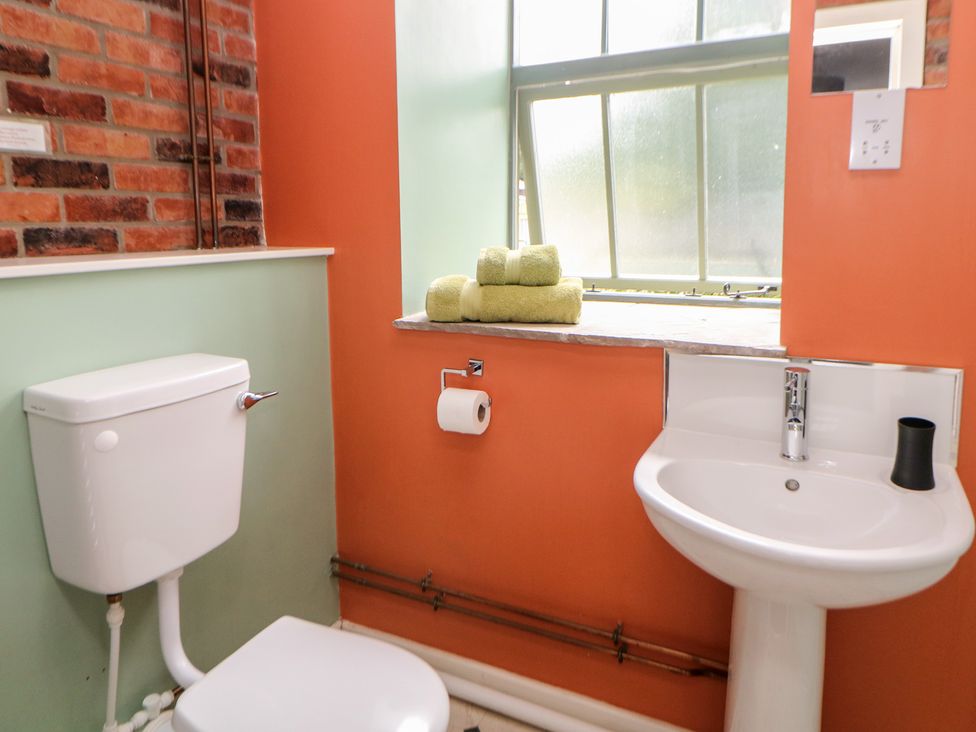 A bathroom with toilet and sink at Meadow View in Buxton