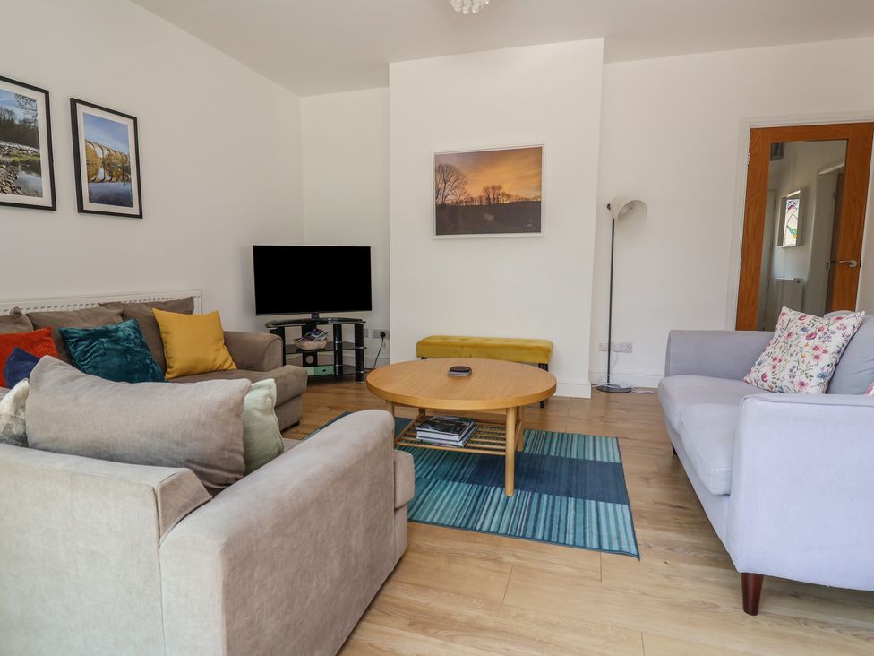 A living room with sofas and a coffee table at Hillcrest in Cefn Mawr near Chirk